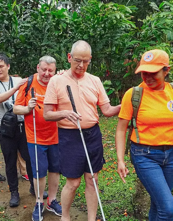 Group of people with visual disabilities on an accessible trail in Panama