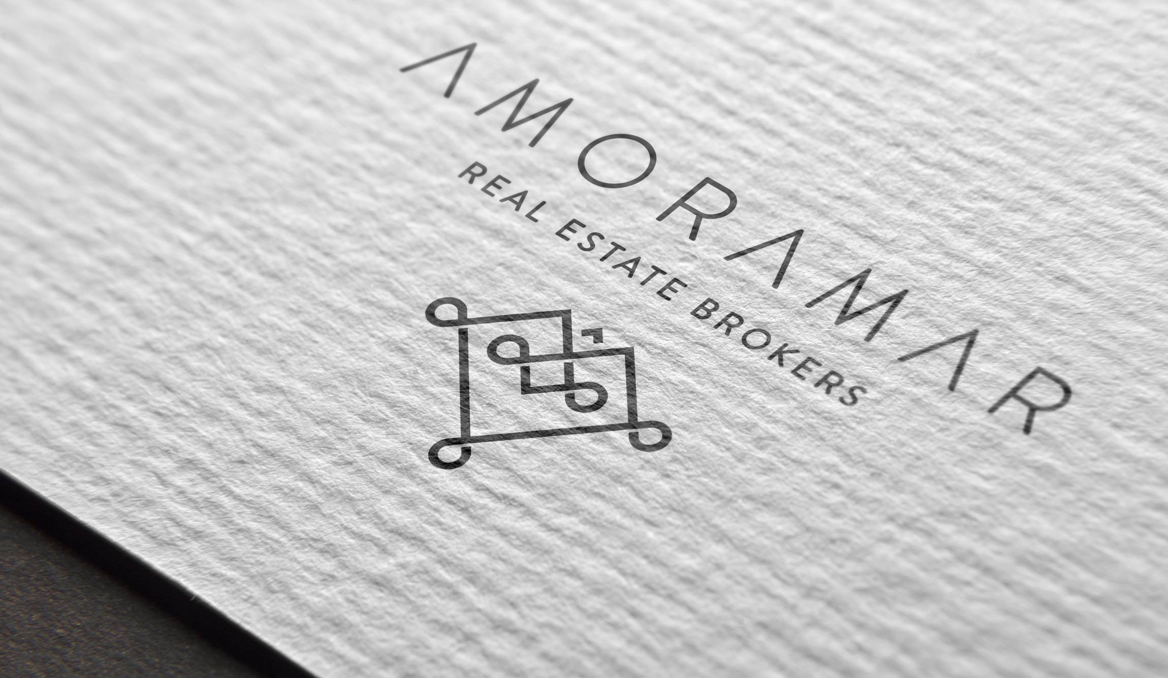 Mockup logo Amoramar Tulum Real Estate Brokers